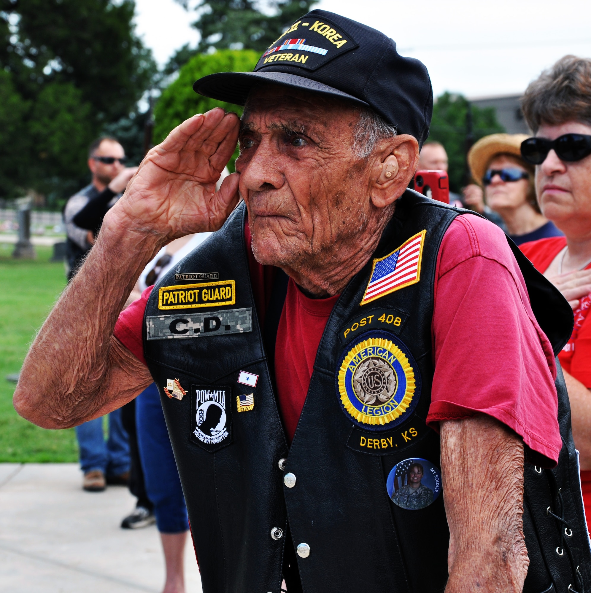 C.D. Studyvin salutes the U.S. flag during a Memorial Day ceremony May 26, 2014, at the El Paso Cemetery in Derby, Kan. The ceremony was conducted by members of the local American Legion and Veterans of Foreign Wars organizations and paid tribute to military members who gave their lives in service to the United States. Studyvin is a Veteran of both World War II and the Korean War. (U.S. Air Force photo/Capt. Zach Anderson) 