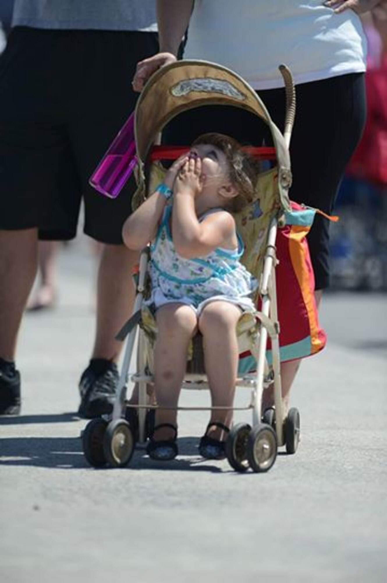 A child reacts to the U.S. Army Parachute Team, “Golden Knights”, during SkyFest 2014 at Fairchild Air Force Base, Wash., May 31, 2014. SkyFest is Fairchild’s air show and open house, giving the local and regional community the opportunity to view Airmen and the base’s resources. The event typically draws more than 150,000 people. SkyFest 2008, headlined by the Blue Angels, was the largest event held in Spokane since the 1974 World’s Fair. (U.S. Air Force photo by Tech. Sgt. Sean Tobin/Released)