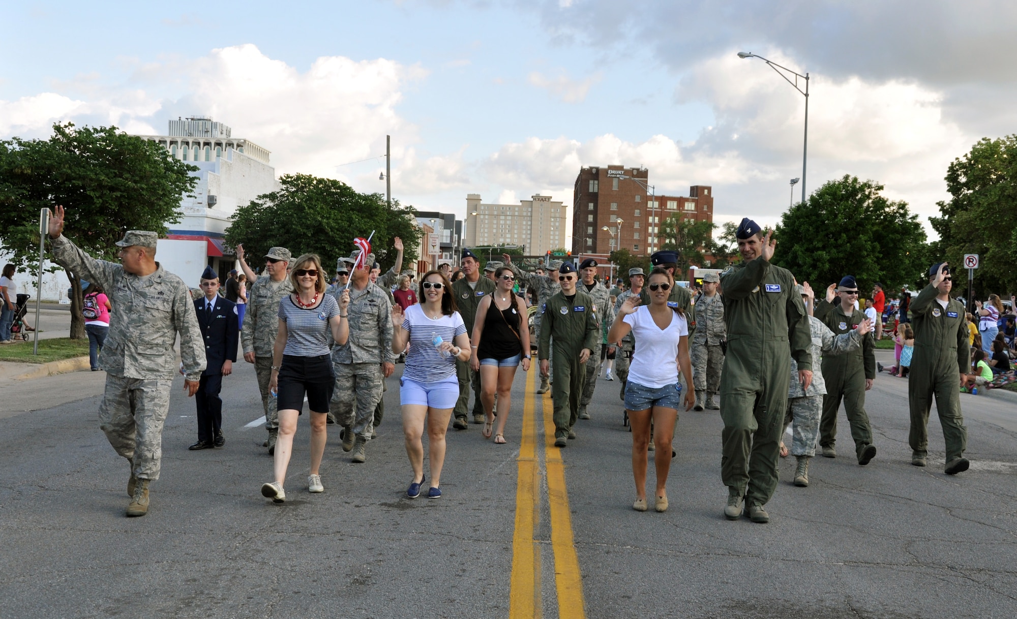 Members of Team McConnell walk through the streets of downtown Wichita, Kan., during the Wichita Riverfest "Sundown Parade," May 30, 2014. The annual parade marks the kickoff of the week-long community festival. Each year, members of the 22nd Air Refueling Wing, the Air Force Reserve 931st Air Refueling Group, and the Kansas Air National Guard184th Intelligence Wing participate in the parade.  (U.S. Air Force photo by Capt. Zach Anderson)