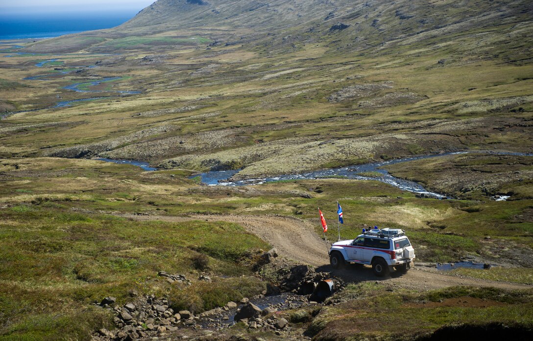 VODLAVIK, Iceland -- An all-terrain truck heads toward a ceremony May 30, 2014, commemorating a rescue mission on the coastline of Vodlavik, Iceland. During the mission, U.S. Airmen saved the lives of six Icelanders stranded aboard their ship, the Godinn. (U.S. Air Force photo/Tech. Sgt. Benjamin Wilson)(Released) 