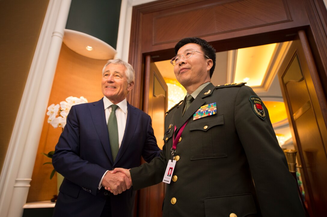 U.S. Defense Secretary Chuck Hagel participates in a bilateral meeting with Lt. Gen. Wang Guanzhong, deputy chief of staff of the Chinese army, at the Shangri-La Dialogue in Singapore, May 31, 2014. 