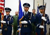 Col. Kurt Matthews, the 919th Special Operations Group commander and Col.  Lt. Col. Casey Burril, stand at attention as the colors are presented by Eglin Air Force Base honor guard during Burril’s assumption of command ceremony for the 919th Special Operations Support Squadron, Oct. 31 at Duke Field Fla.  (U.S. Air Force photo/Tech. Sgt. Samuel King Jr.)
