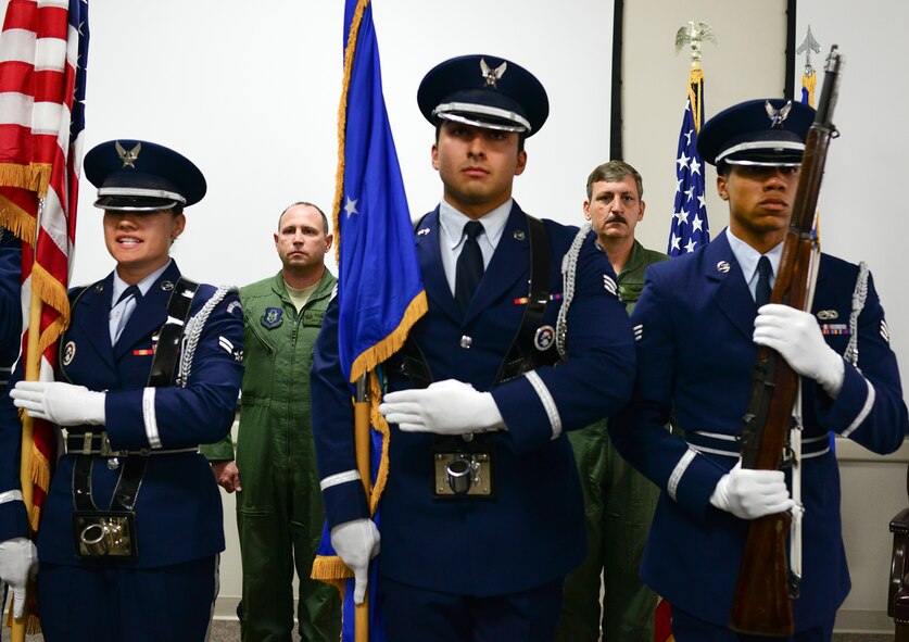 Col. Kurt Matthews, the 919th Special Operations Group commander and Col.  Lt. Col. Casey Burril, stand at attention as the colors are presented by Eglin Air Force Base honor guard during Burril’s assumption of command ceremony for the 919th Special Operations Support Squadron, Oct. 31 at Duke Field Fla.  (U.S. Air Force photo/Tech. Sgt. Samuel King Jr.)