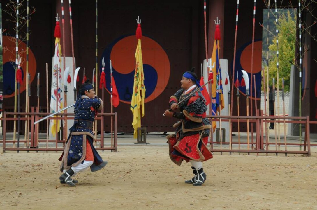 Two Korean guards perform a demonstration exhibiting their warrior skills at the Suwon Palace. 