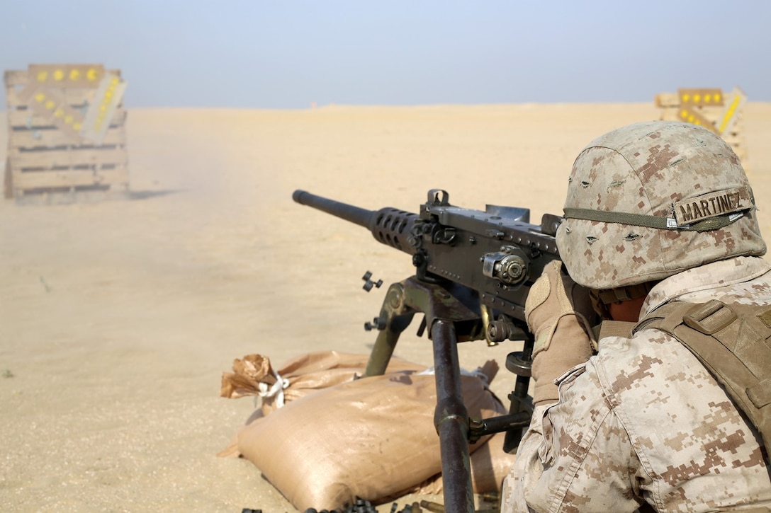 Cpl. Andres Martinez, an Assault Amphibious Vehicle (AAV) crew chief with the AAV platoon, Echo Company, Battalion Landing Team 2nd Battalion, 1st Marines, 11th Marine Expeditionary Unit (MEU), from Atlantic City, New Jersey, engages a target during a live-fire training event with the .50 caliber medium machine gun, Oct. 28. The 11th MEU is deployed with the Makin Island Amphibious Ready Group (ARG) as a theater reserve and crisis response force throughout U.S. Central Command and the U.S. 5th Fleet area of responsibility. (U.S. Marine Corps photo by Sgt. Melissa Wenger/ Released)