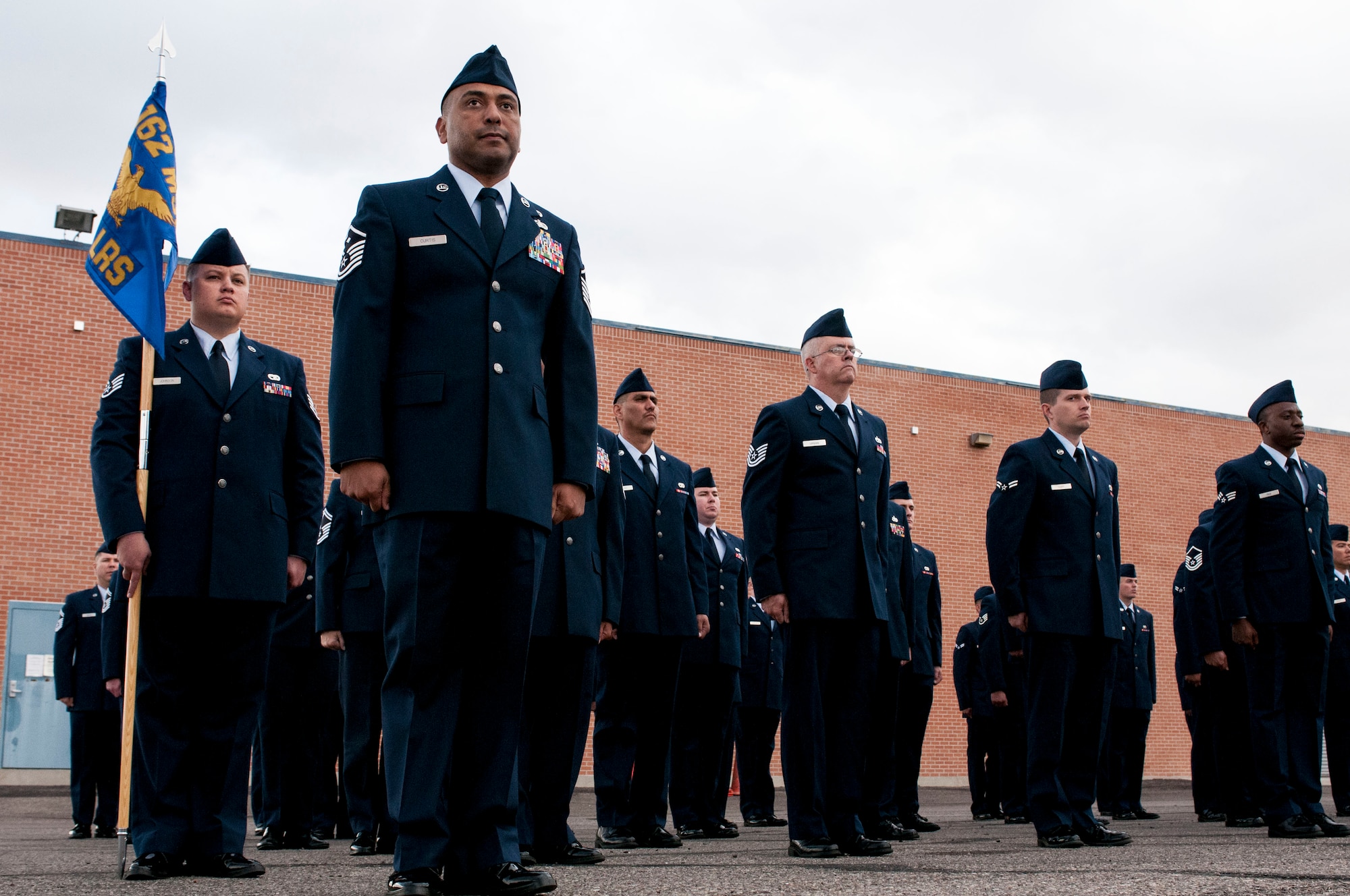 Military bearing…alive and well at the 162nd Wing. Airmen from the 162nd Logistics Readiness Squadron stand in formation during an open ranks inspection on Nov. 2 at the Tucson International Airport. Tech. Sgt. Kenyon Harris, fuel distribution specialist, open ranks was a reminder of his time as a military training leader during his technical training time. “Open ranks is all about attention to detail, which leads to the big picture of keeping the fight alive, supporting our customers and staying true to the mission,” he said. (U.S. Air National Guard photo by Tech. Sgt. Hollie A. Hansen/Released)