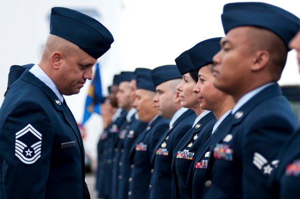 Keeping that guard up. By means of an open ranks inspection, Senior Master Sgt. Daniel Ramirez reviews Airmen from the 162nd Logistics Readiness Squadron on Nov. 2 at the Tucson International Airport. “As the new LRS superintendent, it's my duty to always instill the squadron with pride and professionalism,” said Ramirez. (U.S. Air National Guard photo by Tech. Sgt. Hollie A. Hansen/Released)