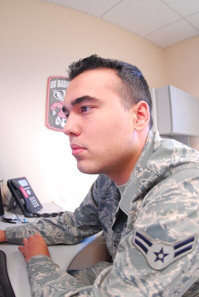 Airman First Class Chad Bridgeman, 120th Airlift Wing Communications Squadron cyber security specialist, checks his privacy settings on Facebook. (National Guard photo/Senior Airman Nikolas Asmussen) 
