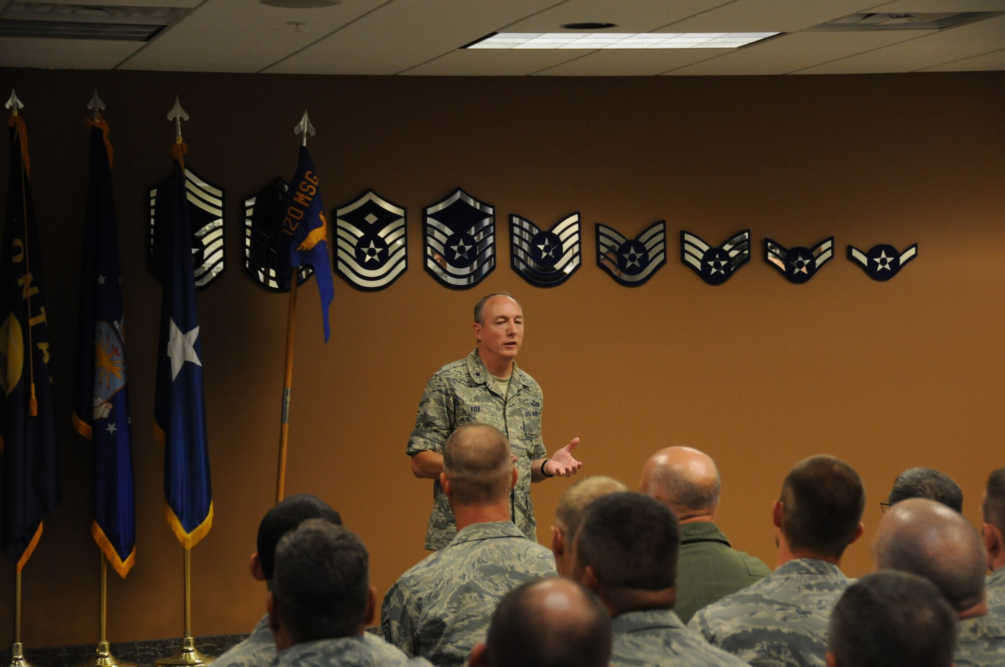 Brig. Gen. Bryan Fox, Monatana Air National Guard commander, addresses a group of 120th Airlift Wing Airmen prior to the September Unit Training Assembly Sept. 6, 2014. 
(National Guard photo/Tech Sgt. Michael Touchette)

