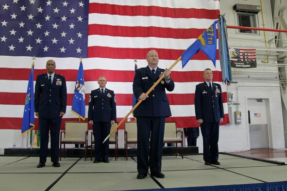 141102-Z-NJ721-179 -- Brig. Gen. John D. Slocum holds the flag of the 127th Wing as he officially assumes command of the wing during a ceremony Sunday, Nov. 2, at Selfridge Air National Guard Base. Behind Slocum are Brig. Gen. Leonard W. Isabelle, Jr., commander of the Michigan Air National Guard; Col. Philip R. Sheridan, outgoing 127th Wing commander; and Chief Master Sgt. Robert Dobson, command chief master sergeant of the 127th Wing. (U.S. Air National Guard photo by Tech. Sgt. Robert Hanet)