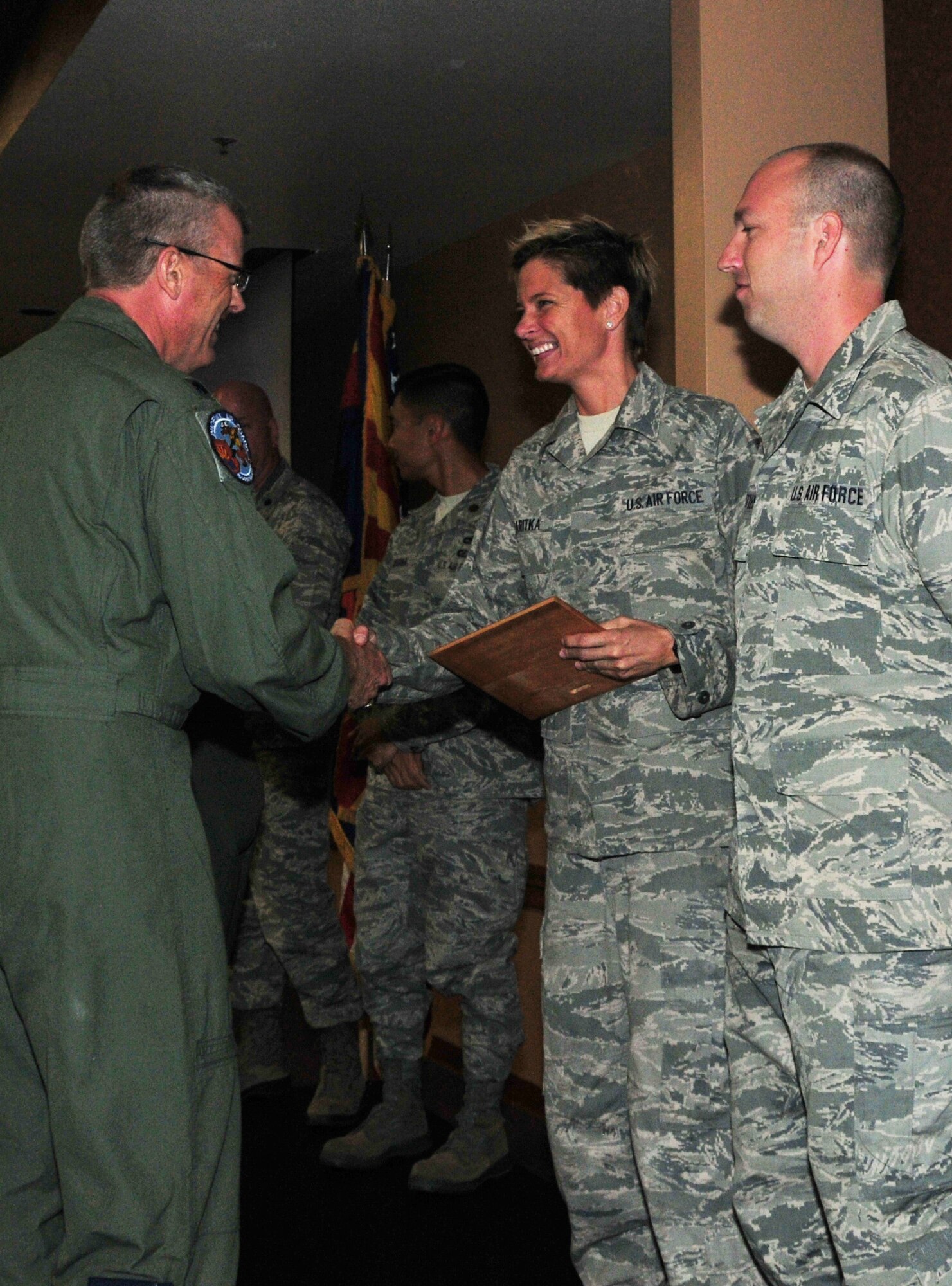 (From Left) Lt. Col. Jim Gloss, 197th Air Refueling Squadron commander, presents 161st Maintenance Group crew chiefs Tech. Sgt. Bethany Skaritka and Staff Sgt. Chris Hostetler with the 161st Air Refueling Wing safety award for “outstanding actions”, Phoenix, Nov. 2, 2014. These crew chiefs, along with Staff Sgt. Nick Savasta, prevented an in-flight emergency by noticing a hydraulic leak just as the aircraft was about to take off. “These types of recognitions go a long way with building a strong working relationship between Ops and Maintenance,” said Maj. Gilbert Besana, 161st Aircraft Maintenance Squadron commander. “It also reminds our guys of how important their jobs are and reminds us all that ‘if you see something, say something.’” (U.S. Air National Guard Photo by Tech. Sgt. Courtney Enos/Released)