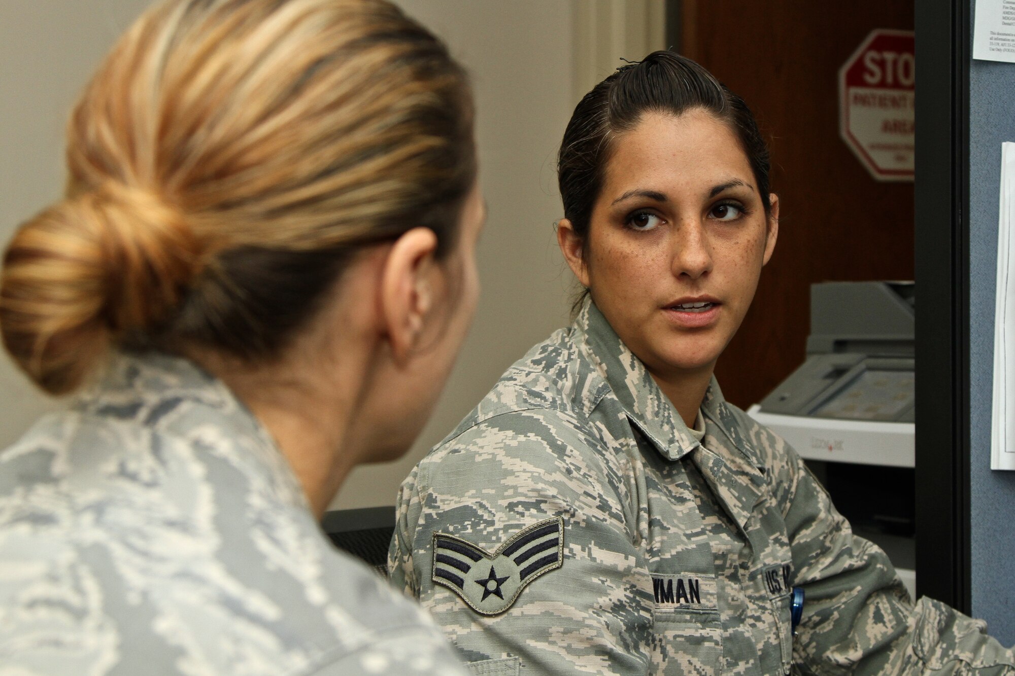 Senior Airman Antonia Lowman, a public health technician with the 315th Aerospace Medical Squadron, reviews a baseline hearing test with Maj. Nicole Hurley, 315th AMDS officer in charge, after her test Saturday Nov. 1, 2014, in the aerospace medicine office here at Joint Base Charleston, South Carolina. (U.S. Air Force photo by Staff Sgt. Rashard Coaxum)