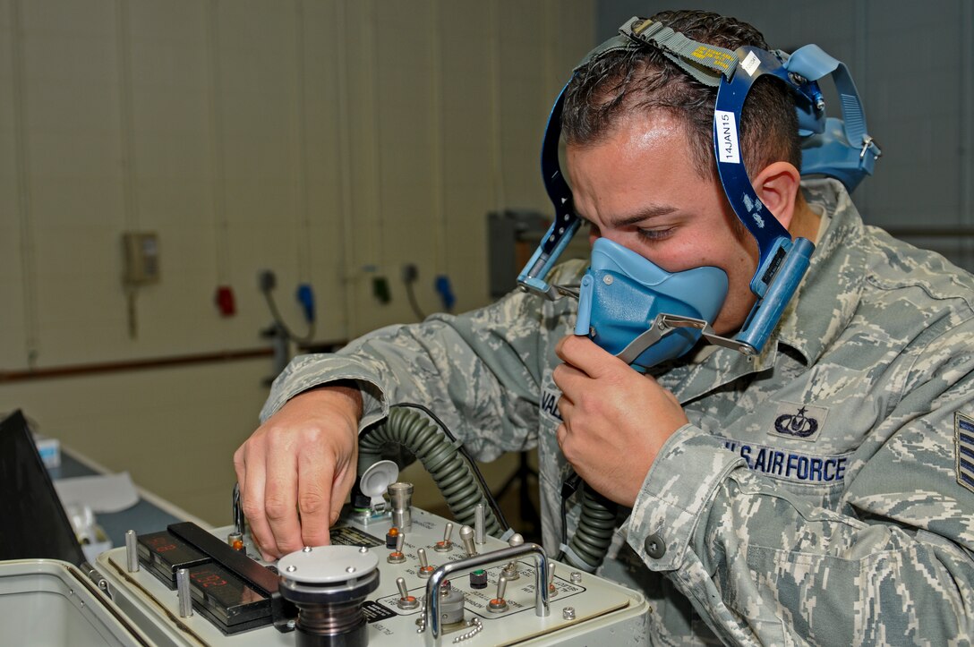 U.S. Air Force Tech. Sgt. Dominic Valle from the 2nd Air Refueling Wing conducts a pressure test on a quick-don oxygen mask during exercise Vigilant Shield on 5 Wing Goose Bay, Canada, Oct. 25, 2014. The Vigilant Shield field training exercise is a bi-national NORAD Command exercise which provides realistic training and practice for American and Canadian forces in support of respective national strategy for North America???s defense. NORAD ensures U.S. and Canadian air sovereignty through a network of alert fighters, tankers, airborne early warning aircraft, and ground-based air defense assets cued by interagency and defense surveillance radars. (U.S. Air Force photo by Staff Sgt. Troy Anderson / RELEASED)