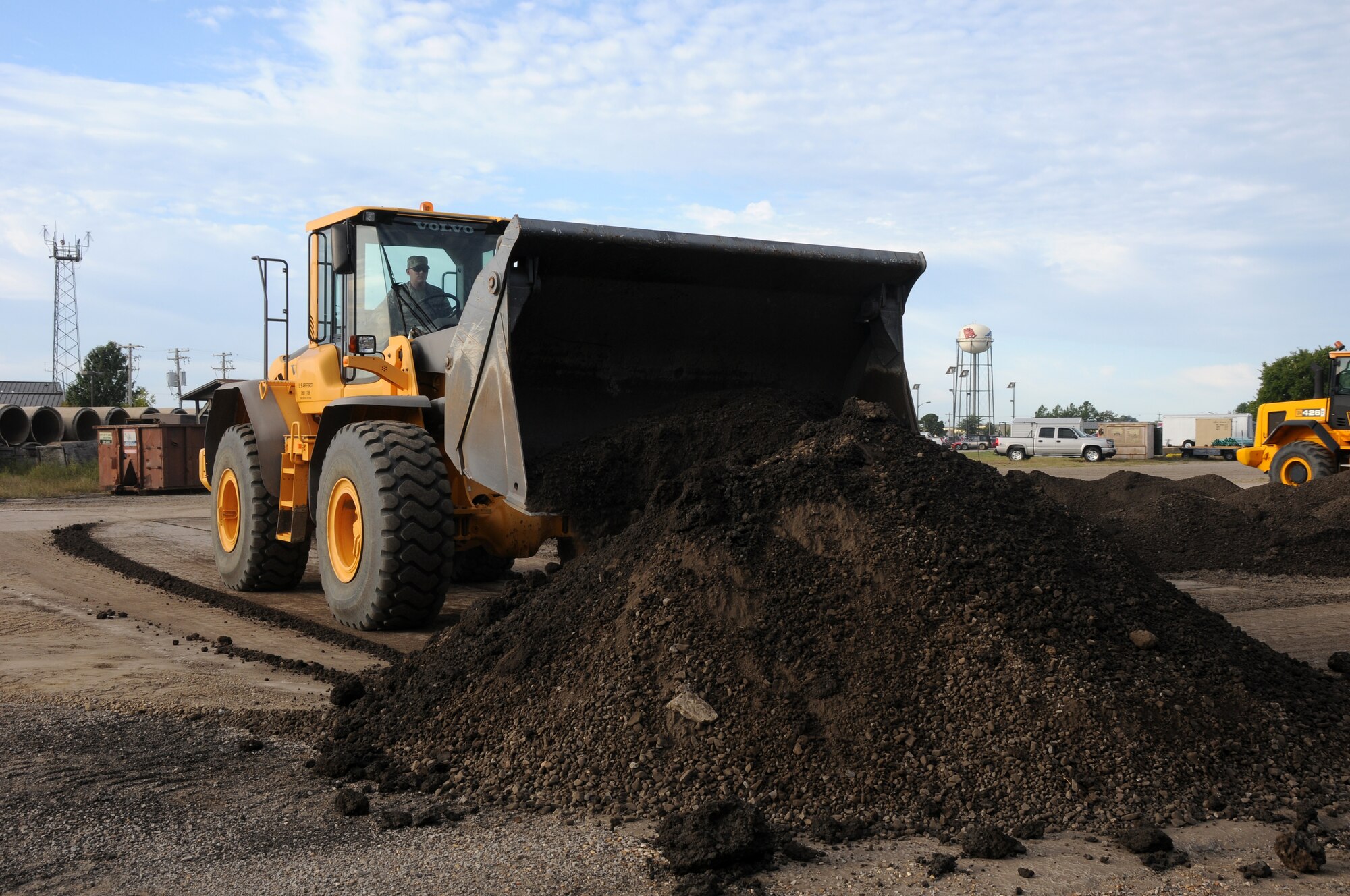 Senior Airman Ethan Robinson, a member of 188th Civil Engineering Squadron operates a Volvo front-end loader during an exercise at Ebbing Air National Guard Base, Fort Smith, Ark., Oct. 5, 2014. (U.S. Air National Guard photo by Airman 1st Class Cody Martin/Released)