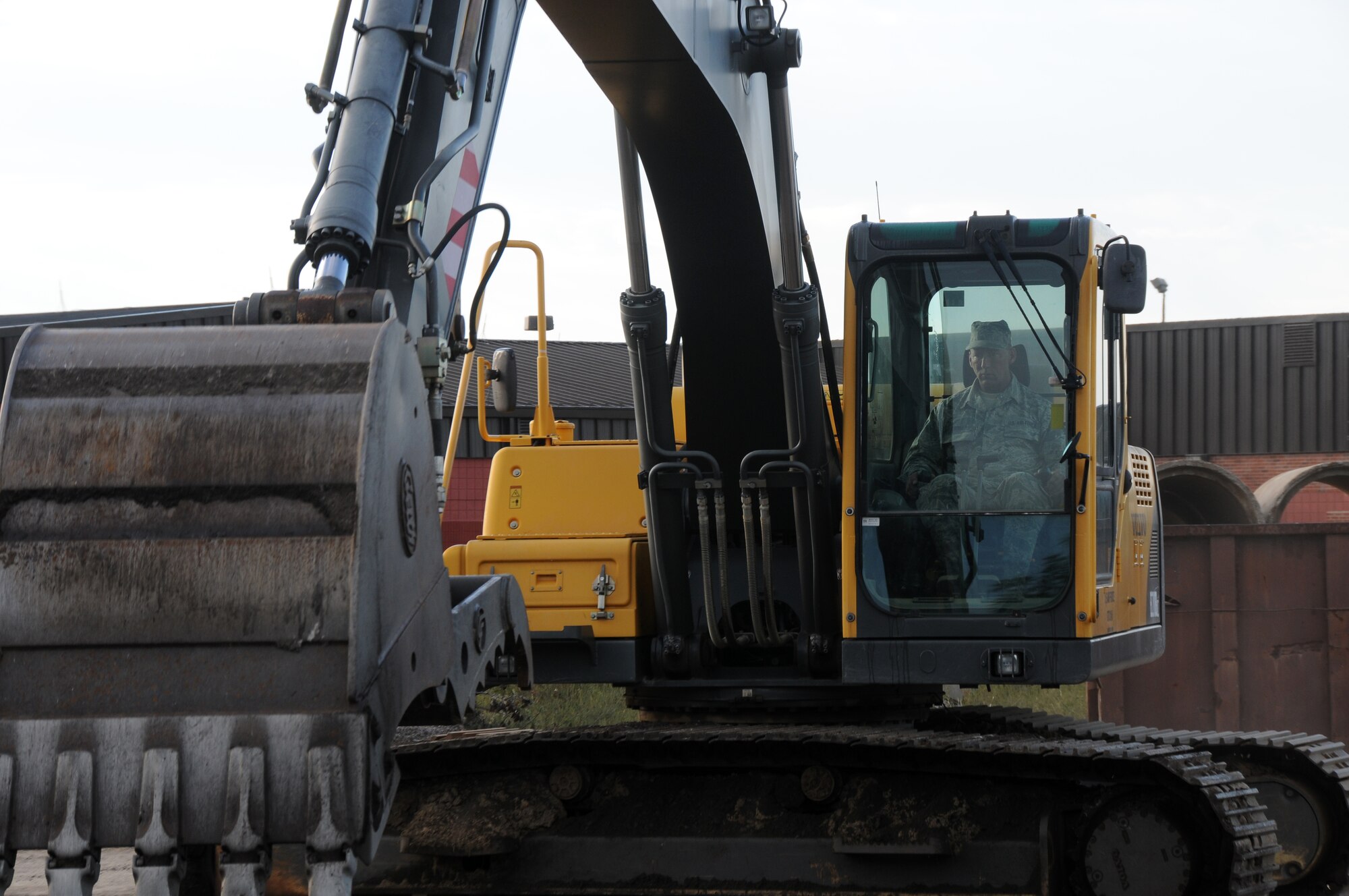 Tech. Sgt. Jeff Crowder, a member of the 188th Civil Engineering Squadron, operates a Volvo excavator at Ebbing Air National Guard Base, Fort Smith, Ark., Oct. 5, 2014. (U.S. Air National Guard photo by Airman 1st Class Cody Martin/Released) 