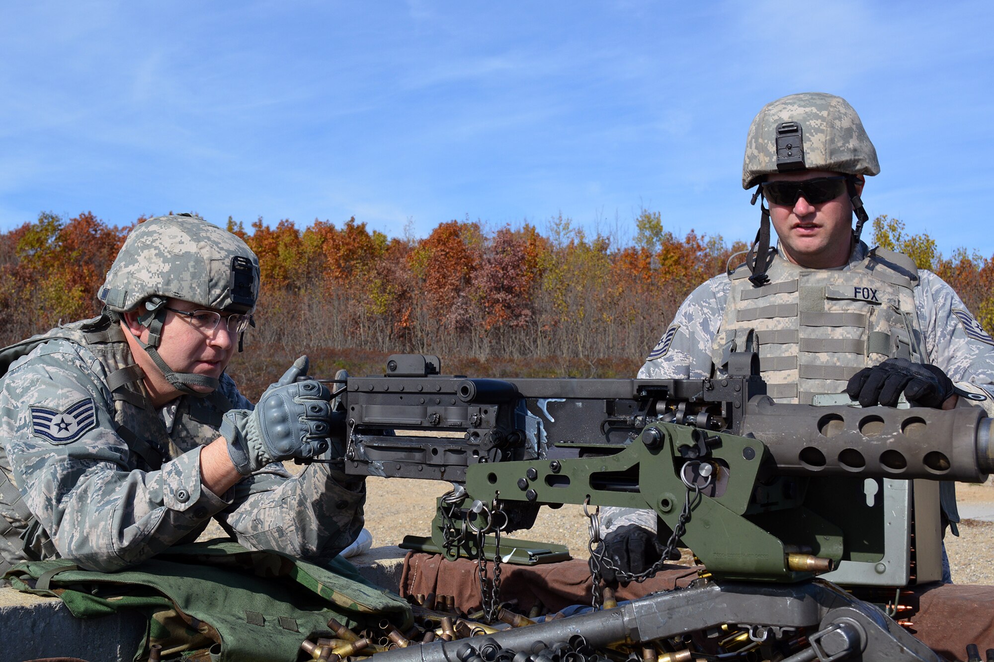 Staff Sgt. Dan Shaughnessy fires his qualification course with a 50-caliber M2 machine gun while Tech. Sgt Charlie Fox serves as his assistant gunner. Both Airmen are members of the 127th Security Forces Squadron, Michigan Air National Guard. (U.S. Air National Guard photo)