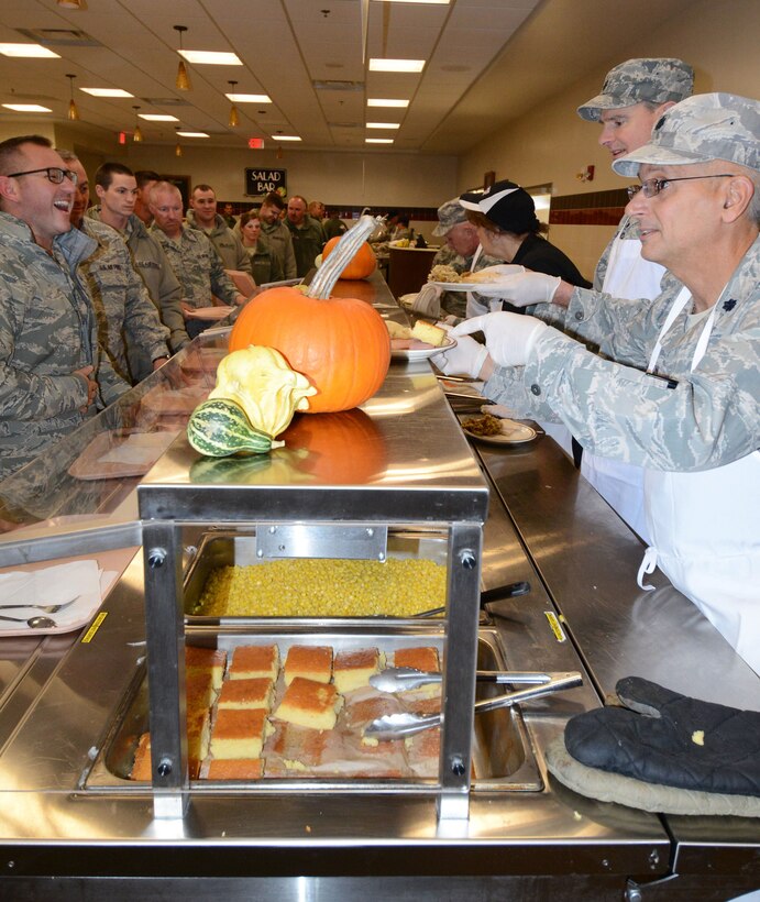 Commanders and First Sergeants serve lunch to members of the 914th Airlift Wing at the 914 Force Support Squadron Dining Facility on November 1, 2014. Wing leadership was participating in a tradition by serving the "Annual Holiday Meal" to say thank you to the personnel of the 914th AW "for a job well done." The holiday meals are very popular and the Dining Hall staff typically serves between 600 - 700 meals during the two-hour time period.