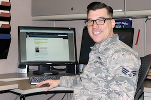 Senior Airman Chris Jones, wo was promoted to staff sergeant two days after this photo was taken, sits at a computer console in the 127th Communications Squadron at Selfridge Air National Guard Base, Mich., Oct. 30, 2014. Jones recently joined the Michigan Air National Guard and works as a Cyber Systems Operator. He previously worked in the intelligence career field as an active duty member of the U.S. Air Force. (U.S. Air National Guard photo by Tech. Sgt. Dan Heaton)