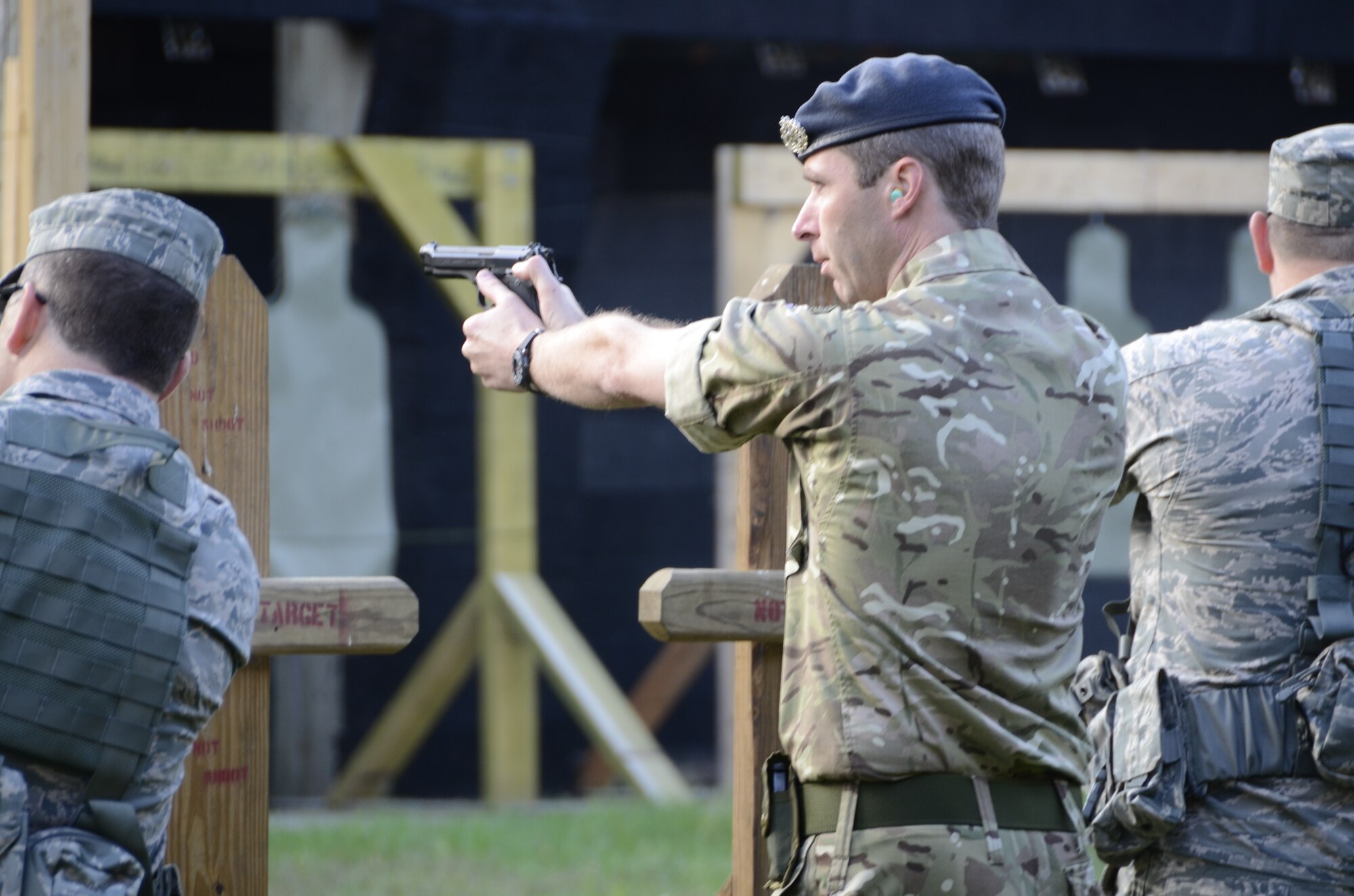 The United Kingdom’s Royal Air Force Cpl. Andrew “Neil” Manson trains at a firing range at Volk Field, Wisconsin, with members of the South Dakota Air National Guard Ready Augmentee Team. (National Guard Photo by Senior Master Sgt. Nancy Ausland)