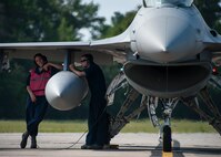 End-of-runway Airmen wait for inspection completion of the F-16 Fighting Falcon at Eglin Air Force Base, Fla., Aug. 7.  The 96th Maintenance Group’s end-of-runway crew is the initial and final set of eyes to examine 53rd Wing and 96th Test Wing aircraft before takeoff and upon arrival. (U.S. Air Force photo/Tech. Sgt. Jasmin Taylor)
