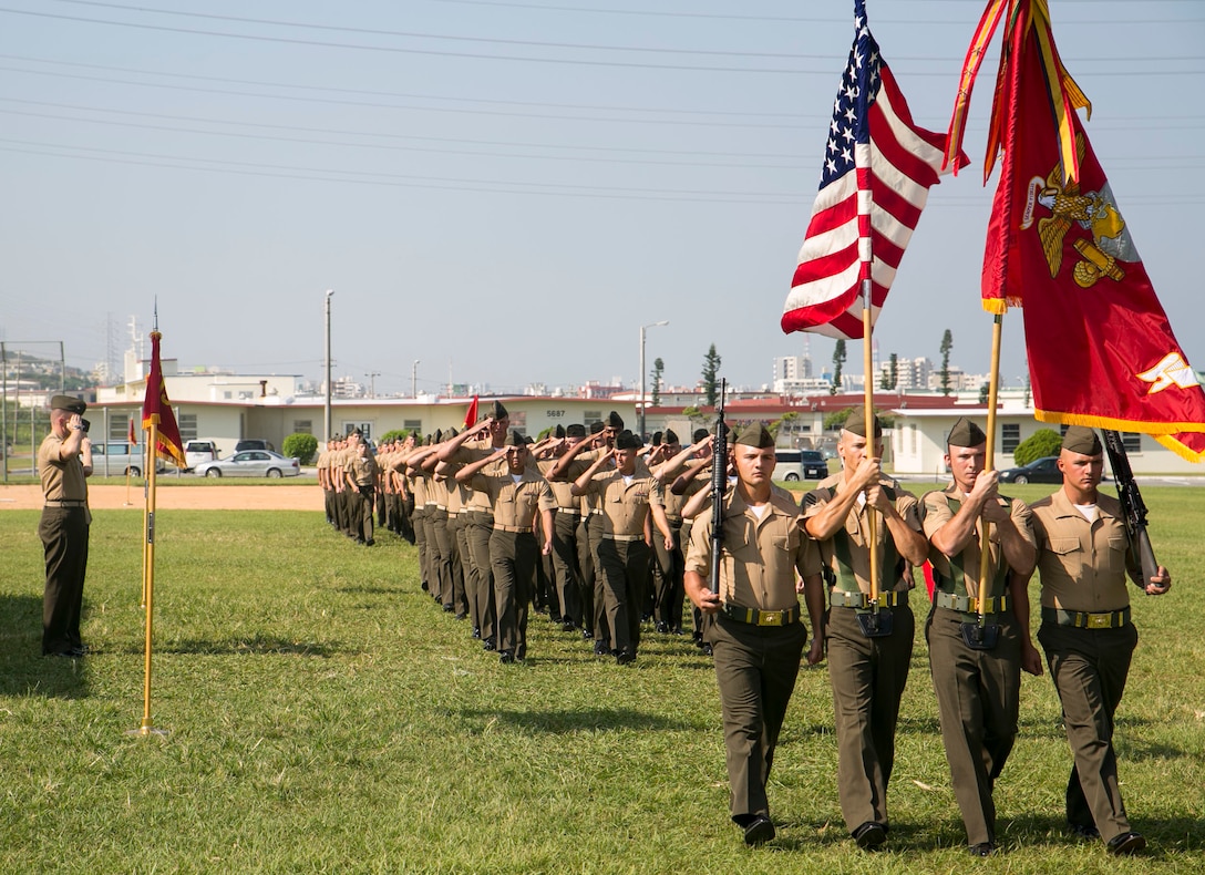 Lt. Col. Maria McMillen and Col. Edward Bligh salute the Marines during the redesignation ceremony for 3rd Transportation Support Battalion Oct. 1 at the parade field on Camp Foster. The battalion is comprised of headquarters, motor transport, landing, and support companies. Consolidating the four companies will improve the support available to III Marine Expeditionary Force, according to Bligh. McMillen is from Craig, Colorado, and the commanding officer for 3rd TSB, Combat Logistics Regiment 3, 3rd Marine Logistics Group, III Marine Expeditionary Force. Bligh is from Athens, Pennsylvania, and is the commanding officer for CLR-3. 