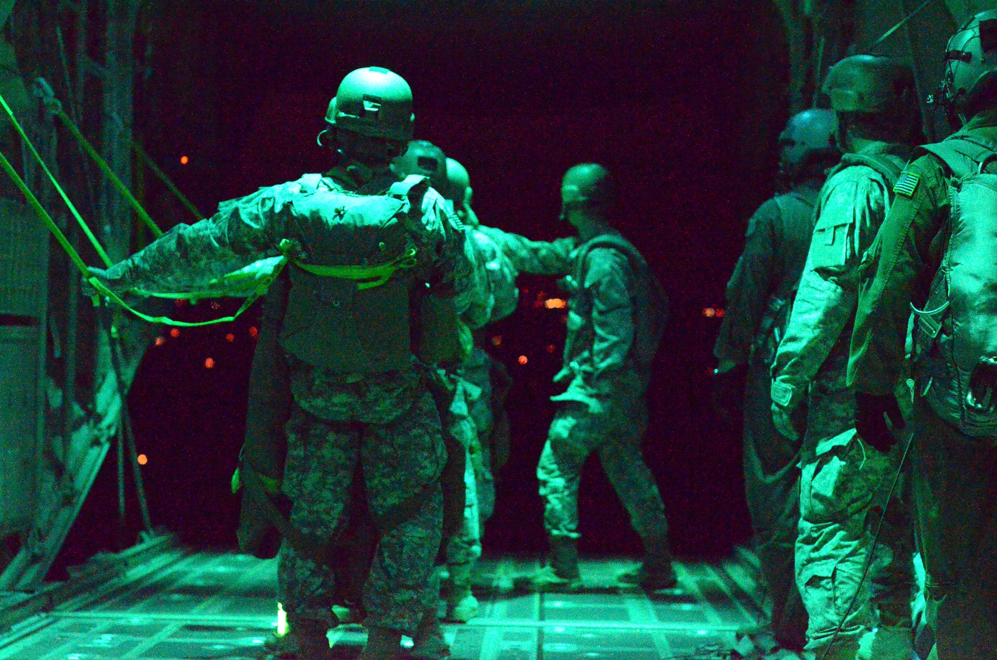 The 160th Special Operations Aviation Regiment paratroopers prepare to jump out of an 815th Airlift Squadron C-130J  Super Hercules to establish a forward arming and refueling point in support of the Operation Southern Strike exercise Oct. 29, 2014, in Miss. The 160th SOAR is headquartered in Fort Campbell, Ky. The 815th AS is an Air Force Reserve unit stationed at Keesler Air Force Base, Miss. (U.S. Air Force photo/Master Sgt. Brian Lamar) 
