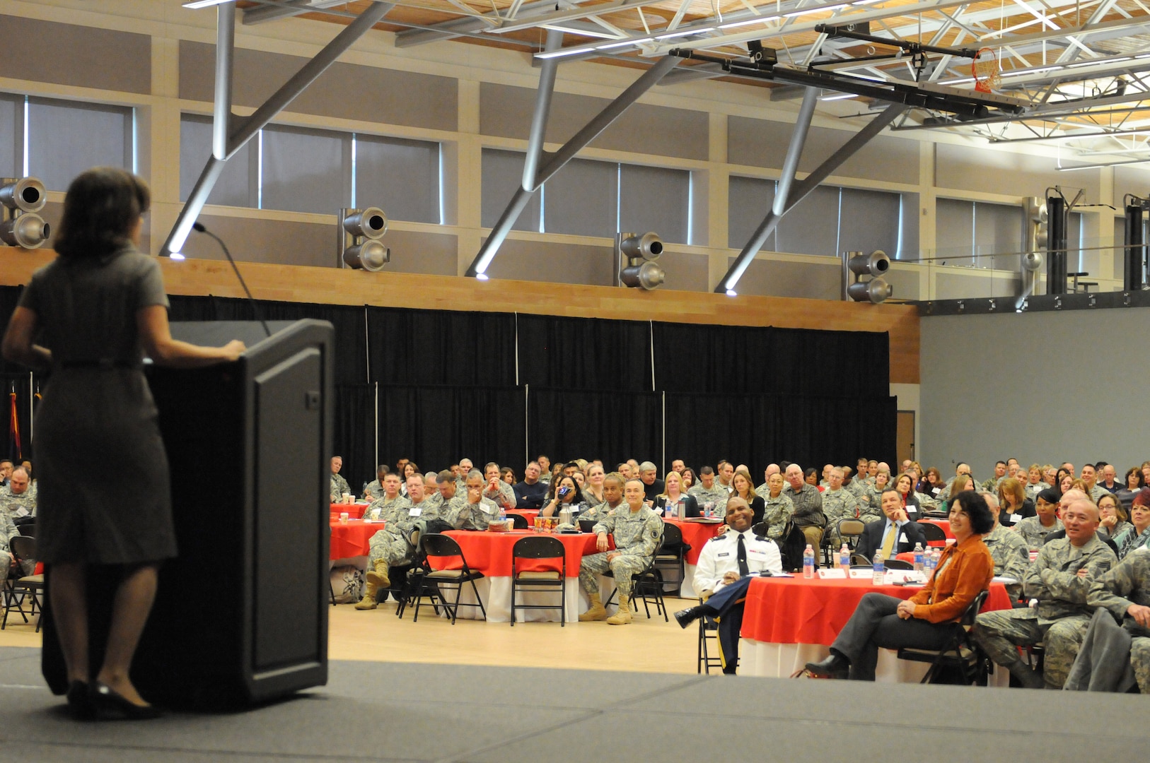 Speakers addressed a military and civilian audience at Camp Dawson, W. Va., Oct. 30, 2014. A three-day, first-ever national Joining Community Forces Workshop wrapped up Oct. 31 between local, state and federal representatives.