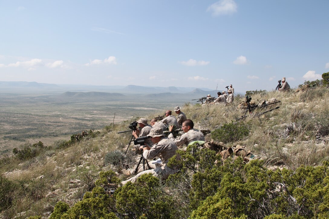 Marine Corps snipers  D Company, 4th Reconnaissance Battalion, 4th Marine Division fire their M40A5 Sniper Rifles from high angles at unknown distance targets at greater than 1,000 yards during a simulated overseas firing scenario at High Angle Range, 9 Mile Training Center in Pecos County, Texas, Sept. 24, 2014. Marine snipers from the 4th Mar. Div. conducted firing exercises that included known and unknown distance 7.62 mm training, night fire, unsupported positions firing, and a team stress shoot. 