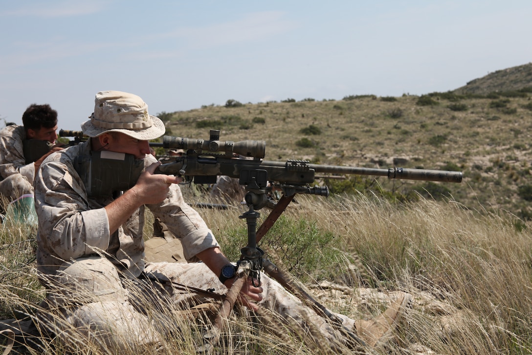 Staff Sgt. Ryan Dowling, a sniper with D Company, 4th Reconnaissance Battalion, 4th Marine Division, fires an M40A5 Sniper Rifle from high angles at unknown distance targets at greater than 1,000 yards during a simulated overseas firing scenario Sept. 24, 2014 at the High Angle Range, 9-Mile Training Center in Pecos County, Texas.  Marine snipers from the 4th Mar. Div. conducted firing exercises that included known and unknown distance 7.62 mm training, night fire, unsupported positions firing, and a team stress shoot.