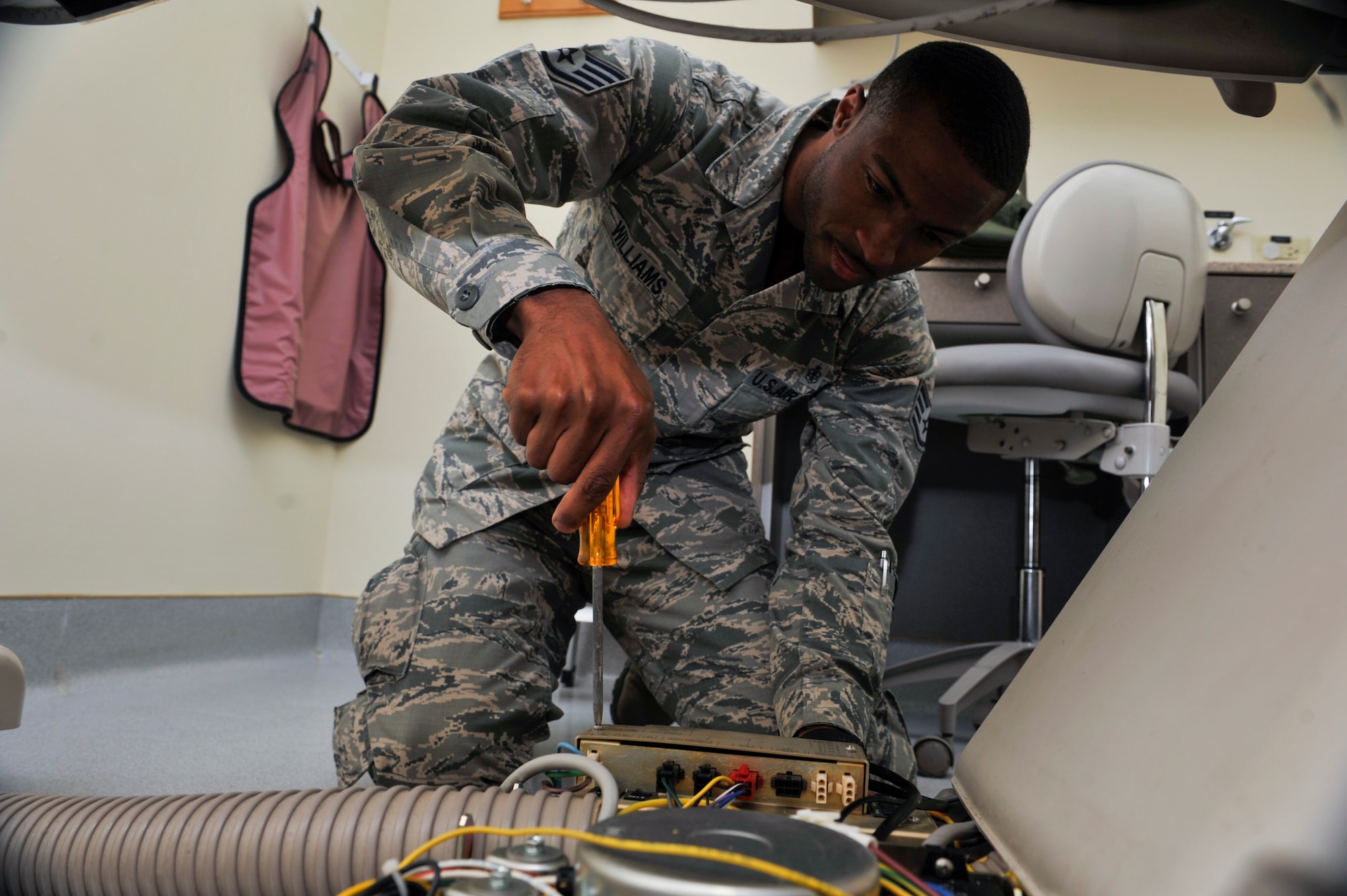 Staff Sgt. Arthur Williams, 51st Medical Support Squadron biomedical equipment technician, repairs the power supply for a dental chair Oct. 24, 2014, on Osan Air Base, Republic of Korea. Williams is this week’s Airman Spotlight winner. (U.S. Air Force photo by Senior Airman David Owsianka)