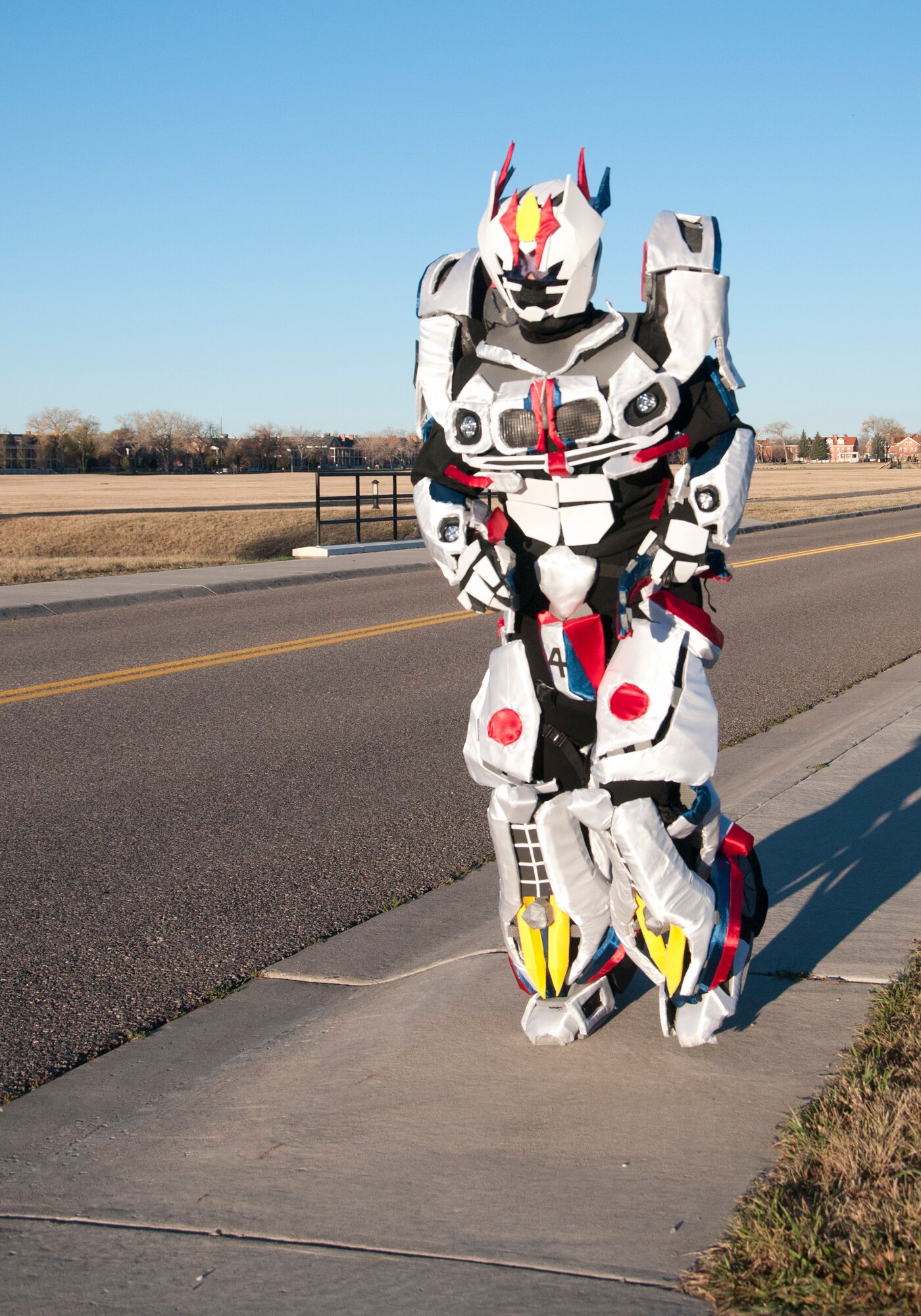 Staff Sgt. Angela McAllister, 90th Munitions Squadron NCO dressed as Jazz from the Transformers universe, nears the finish line of the 90th Force Support Squadron Halloween 5K Oct. 30, 2014. While the other participants fought through the cold morning run, McAllister's costume provided a bit more warmth. (U.S. Air Force photo by Senior Airman Jason Wiese)
