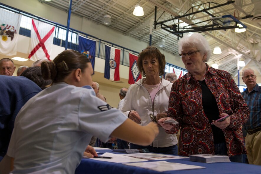U.S. Air Force Airman 1st Class Rachel Nejedlo, 23d Medical Group, prepares retirees and their families for flu vaccinations during the Retiree Appreciation Day health and information fair Nov. 1, 2014, at Moody Air Force Base, Ga.  During the fair, 23d MDG staff provided retirees and their families’ health advice from all of its clinics. (U.S. Air Force photo by Airman 1st Class Dillian Bamman/Released)