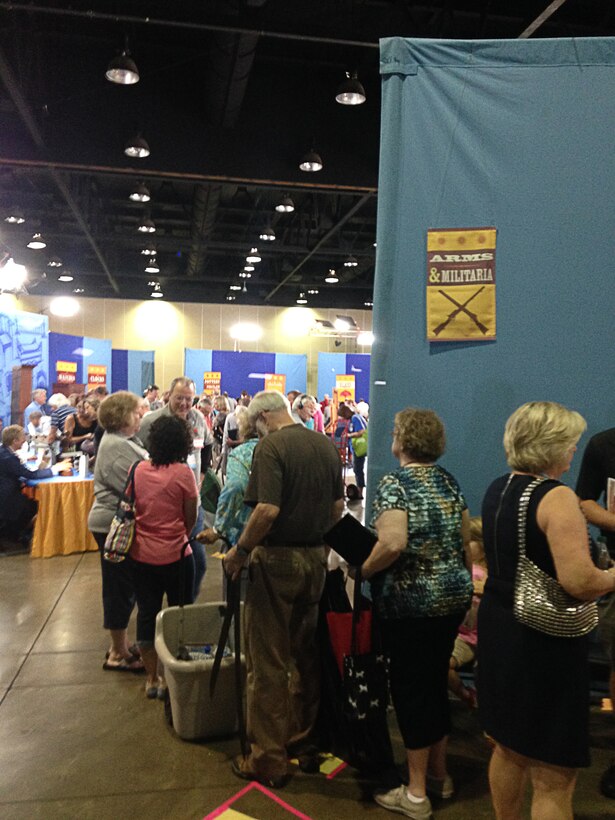 Antiques Roadshow participants wait in line for appraisals at the Birmingham-Jefferson Convention Complex on June 21 where AEDC employees Ben Partin, Mike Northcutt and Jeff Haley had their war memorabilia and family items appraised. (Photo provided)