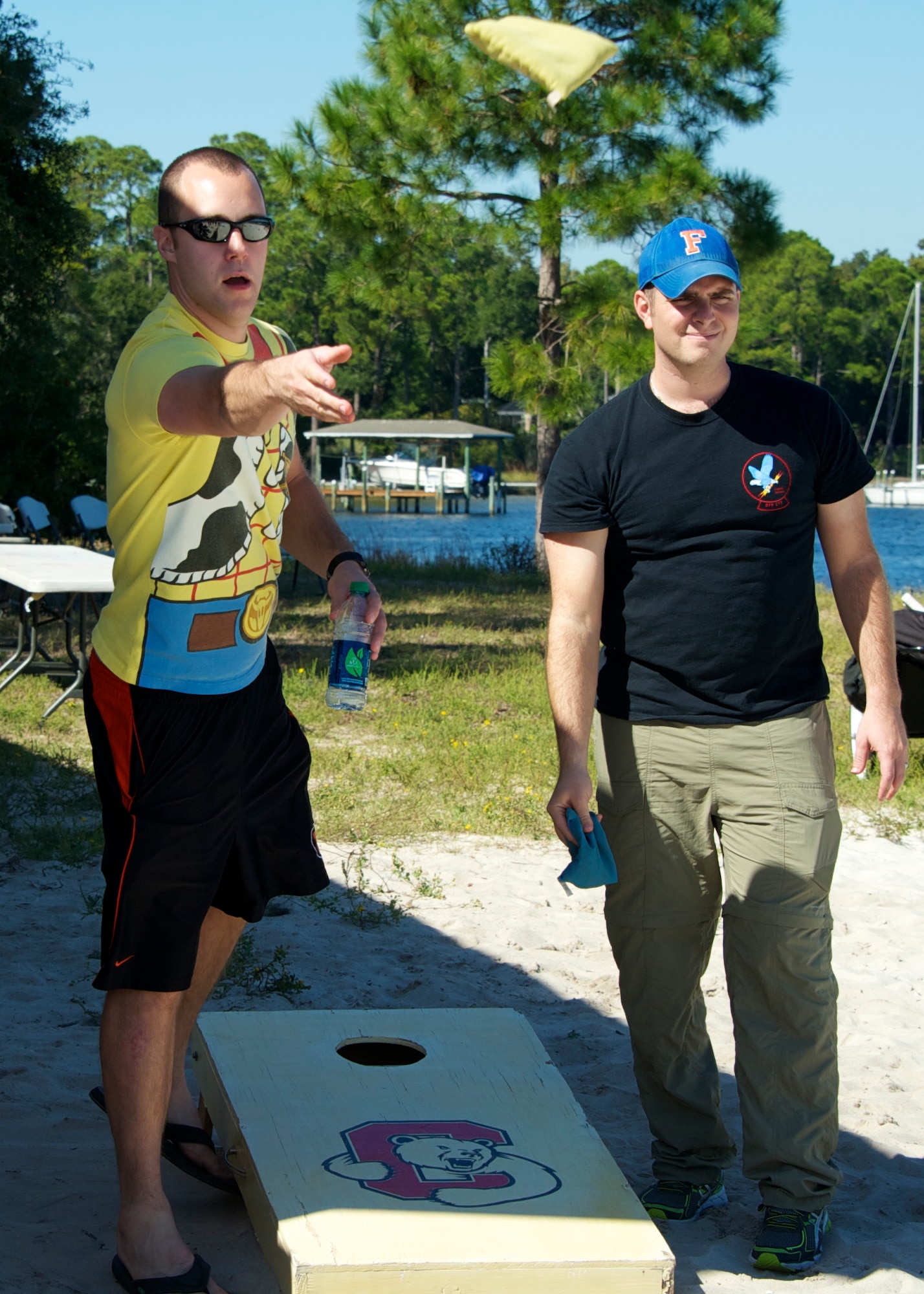 Two Airmen from the 96th Operations Group face off in a cornhole toss tournament during the OG Fun in the Sun at Post’l Point Oct. 31. Various other events and competitions took place during the outing including volleyball, tug-of-war and a cardboard boat race.  The annual event coincided with the 96th Test Wing’s Wingman Day which focused on strengthening relationships and showing respect and resiliency in the workplace. (U.S. Air Force photo/Sara Vidoni)