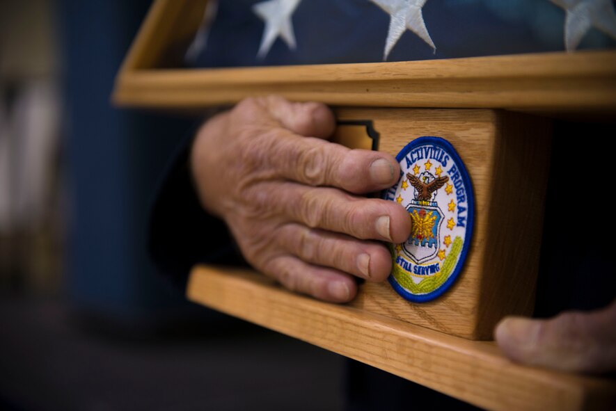 Retired U.S. Air Force Chief Master Sgt. Earl Hendrix, former 347th Tactical Fighter Wing senior enlisted advisor, receives the “Hero Award” during the Retiree Appreciation Day opening ceremony Nov. 1, 2014, at Moody Air Force Base, Ga. Moody’s Retiree Activities Committee selected Hendrix for the award because of his continued support after military service. (U.S. Air Force photo by Airman 1st Class Dillian Bamman/Released)