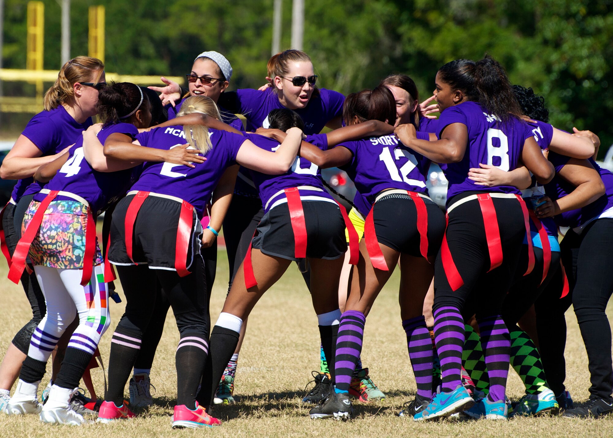 The 96th Logistics Readiness Squadron all-female team celebrates their victory during their powderpuff football game against the 96th Force Support Squadron Oct. 31 at Eglin Air Force Base, Fla. LRS, the reigning champions, took home the win in a 13-0 victory by scoring a touchdown in each half and stopping FSS short in the red zone twice. The annual powderpuff game coincided with the 96th Test Wing’s Wingman Day which focused on strengthening relationships and showing respect and resiliency in the workplace. (U.S. Air Force photo/Sara Vidoni)