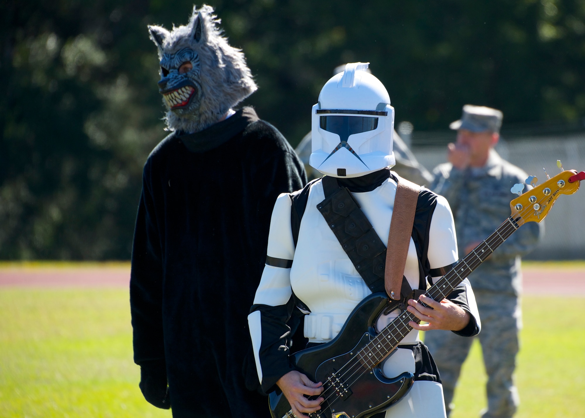 Lt. Col. Brandon Maroon, commander of the 96th Logistics Readiness Squadron, provides sideline entertainment during their annual powderpuff football game against the 96th Force Support Squadron Oct. 31 at Eglin Air Force Base, Fla. LRS, the reigning champions, took home the win in a 13-0 victory by scoring a touchdown in each half and stopping FSS short in the red zone twice. The annual powderpuff game coincided with the 96th Test Wing’s Wingman Day which focused on strengthening relationships and showing respect and resiliency in the workplace. (U.S. Air Force photo/Sara Vidoni)