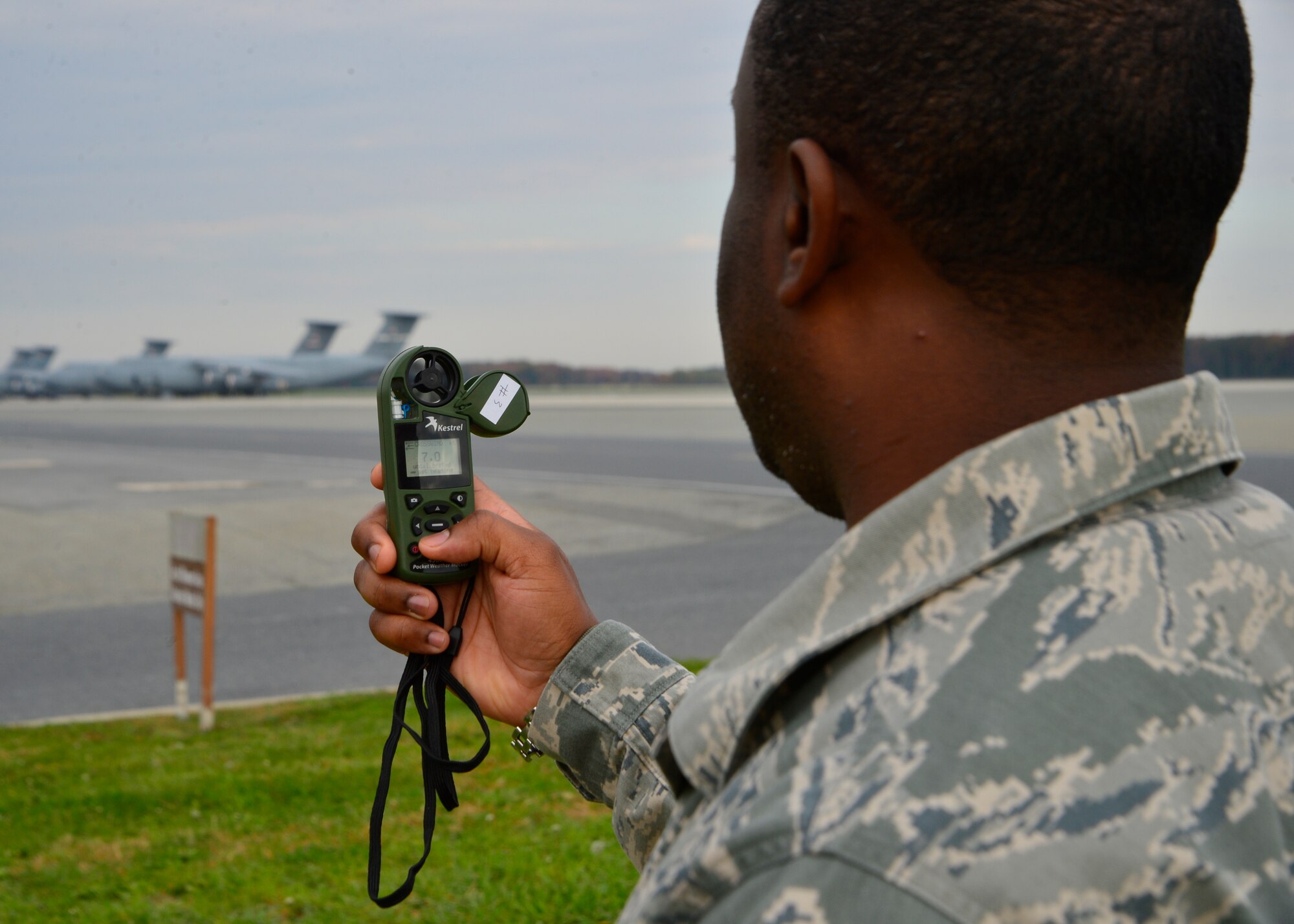 Staff Sgt. Justin Snowden, 436th Operations Support Squadron weather technician, uses a Kestrel 4500 handheld weather meter Oct. 30, 2014, at Dover Air Force Base, Del. Some of the meter’s capabilities include a digital compass and can measure wind direction, crosswind and headwind/tailwind. (U.S. Air Force photo/Airman 1st Class William Johnson)