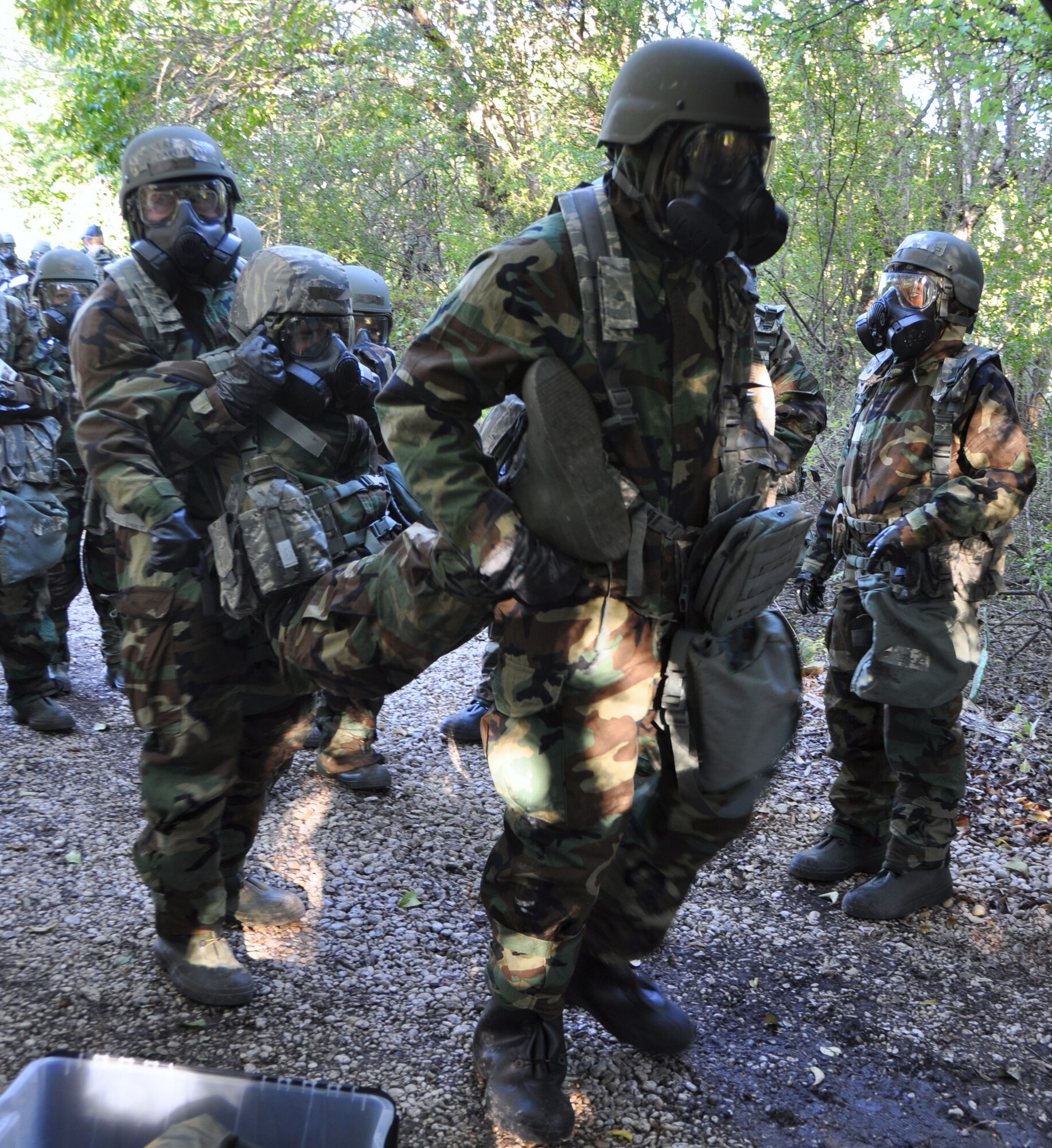 During Operation Ice Breaker, Airmen demonstrate the proper way to transport a sick Airman during a Self Aid and Buddy Care exercise Nov. 1, 2014 on Joint Base San Antonio-Lackland, Texas. (U.S. Air Force Photo by Capt. Cris Medina) 