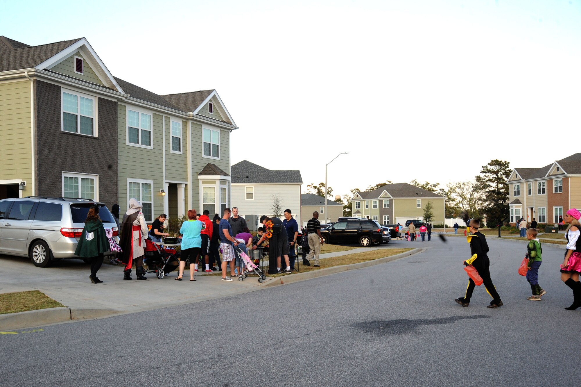 Team Shaw families trick-or-treat at Shaw Air Force Base, S.C., Oct. 31, 2014. Throughout the evening, trick-or-treaters were able to go from house to house collecting candy while the 20th Security Forces Squadron Pumpkin Patrol monitored the streets. (U.S. Air Force photo by Airman 1st Class Michael Cossaboom/Released)