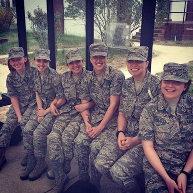 Airman 1st Class Jessica Smith (second from left) and a group of her fellow public affairs Airmen sit at a bus stop at Fort Meade, Md., 2014. The military provides an opportunity to meet new people from various backgrounds and build lifelong friendships. (Courtesy photo)