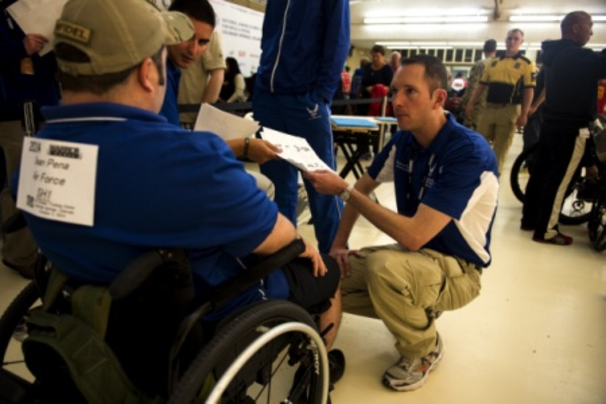 Air Force athlete Seth Pena (left) talks to Ben Payne after a shooting competition during the 2014 Warrior Games at the Olympic Training Center, Colorado Springs, Colo., Oct. 3, 2014. The Warrior Games consists of athletes from throughout the Department of Defense, who compete in Paralympic style events for their respective military branch. The goal of the games is to help highlight the limitless potential of warriors through competitive sports. (U.S. Air Force photo by Airman 1st Class Scott Jackson)