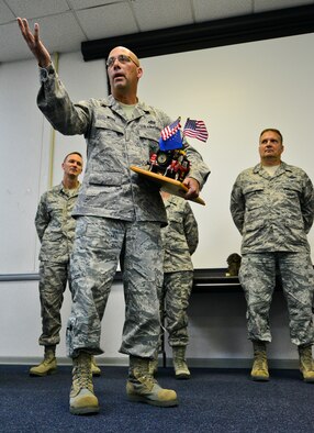 Newly inducted Chief Master Sgt. Pete Webb, 919th Special Operations Civil Engineer Squadron, addresses the audience as the 919th Special Operations Wing’s newest “Jeep Chief” during his ceremony Nov. 2 at Duke Field. The “Jeep Chief” must keep the jeep trophy with them at all times while on duty or “pay” the consequences from the chief’s group. (U.S. Air Force photo/Tech Sgt. Cheryl L. Foster)