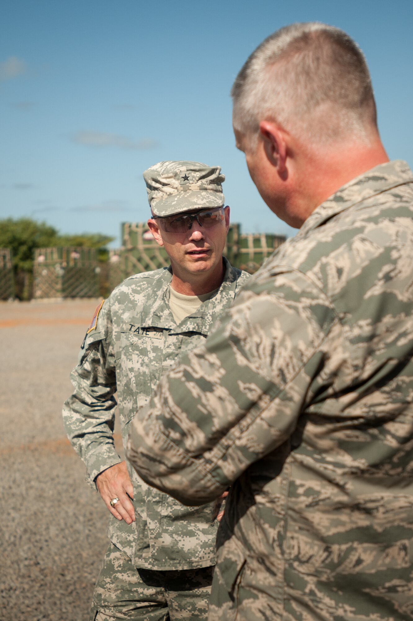 U.S. Army Brig. Gen. Frank W. Tate, deputy commanding general of sustainment for Operation United Assistance, speaks with U.S. Air Force Col. David Mounkes, commander of Joint Task Force-Port Opening Senegal, about JTF-PO operations at Léopold Sédar Senghor International Airport in Dakar, Senegal, Oct. 31, 2014. The JTF-PO, staffed by more than 70 members of the Kentucky Air National Guard’s 123rd Contingency Response Group, is funneling humanitarian supplies and military support into West Africa as part of the U.S. Agency for International Development-led, whole-of-government effort to contain the Ebola virus outbreak. (U.S. Air National Guard photo by Maj. Dale Greer)