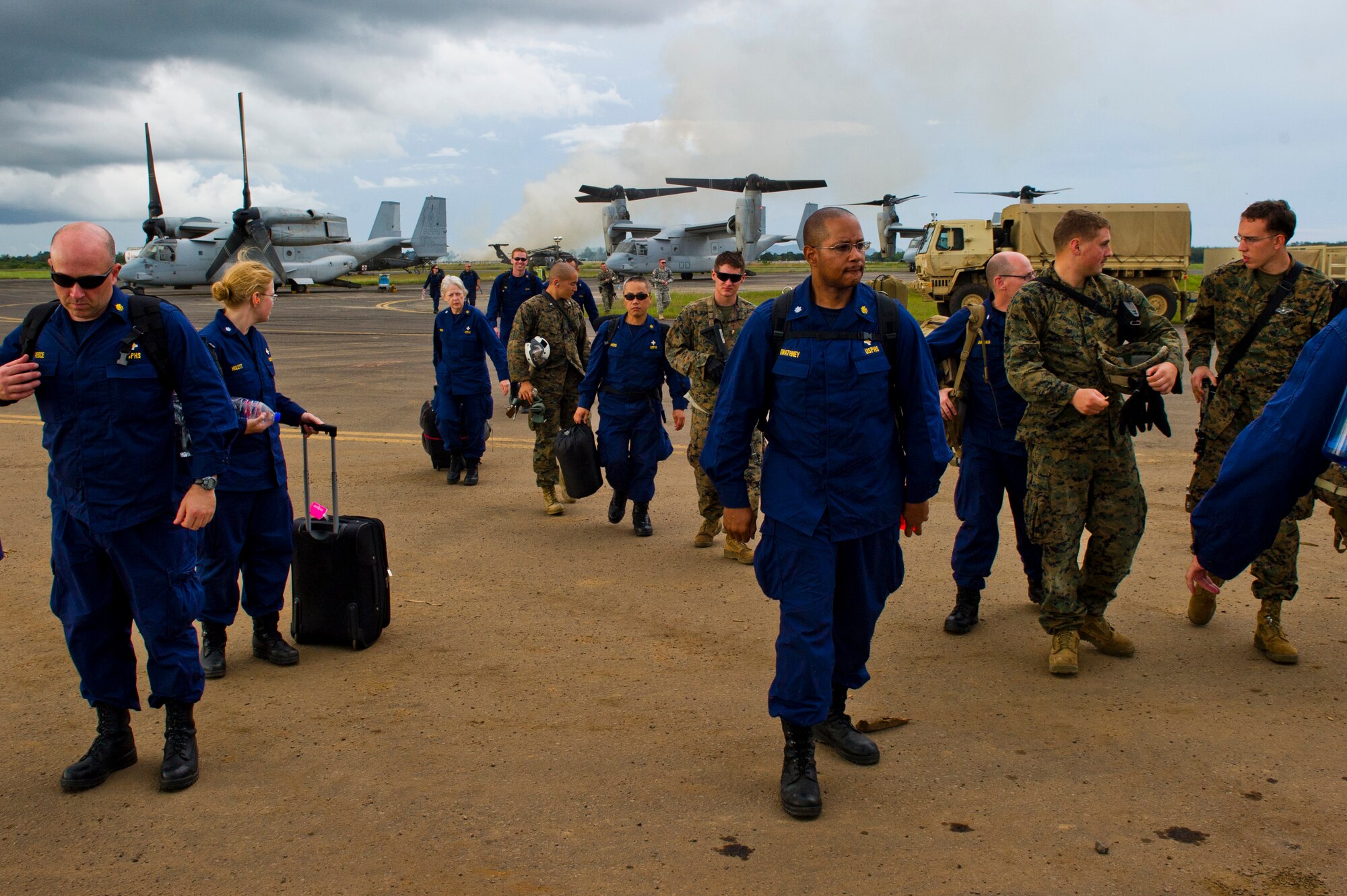 Members of the U.S. Public Health Service and the U.S. Marines return here, during Operation United Assistance, Oct. 31, 2014. OUA is a U.S. Joint Forces Command-led operation to provide command and control, logistics, training and engineering support to the U.S. government’s efforts to contain the Ebola virus outbreak in West African nations. (U.S. Air Force photo by Staff Sgt. Gustavo Gonzalez/Released)