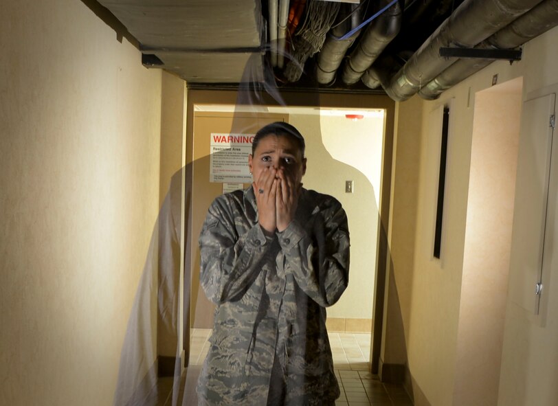 A mysterious figure scares an unsuspecting Airmen in the basement of the 2nd Civil Engineer Squadron on Barksdale Air Force Base, La. Before becoming the home of the 2nd Civil Engineer Squadron, the building was once Barksdale’s full service hospital which included everything from births to deaths. (U.S. Air Force photo illustration/Mozer O. Da Cunha)
