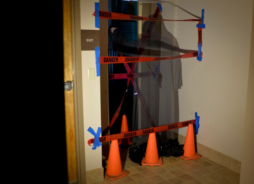 A mysterious figure pauses alongside one of the static displays at the Barksdale Global Power museum on Barksdale Air Force Base, La. For a base with a long history such as Barksdale, 80 years young, it has given way to numerous stories and spooky feelings as if we are not alone in the darkness of night. (U.S. Air Force photo illustration/Airman 1st Class Mozer O. Da Cunha)