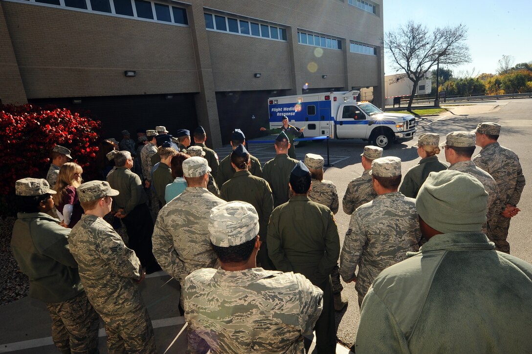 Members of the 55th Aerospace Medicine Squadron gather around and listen to their commander U.S. Air Force Col. Thatcher R. Cordon give opening remarks regarding their new location in the Ehrling Bergquist Clinic during a formal ribbon cutting ceremony held Oct. 29, Offutt Air Force Base, Neb.  The 55th Aerospace Medicine Squadron’s move will streamline the use of resources as well as a convenience for its customer base.  (U.S. Air Force photo by Josh Plueger/Released)