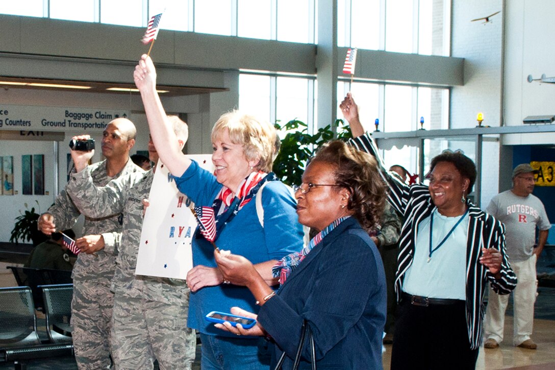 Family and friends greet returning U.S. Air Force Airmen at Shreveport Regional Airport, Oct. 29, 2014, Shreveport, La. The Airmen are assigned to the 307th Security Forces Squadron and are returning home after a six-month long deployment in support of Operation Enduring Freedom. (U.S. Air Force photo by Master Sgt. Dachelle Melville/Released)