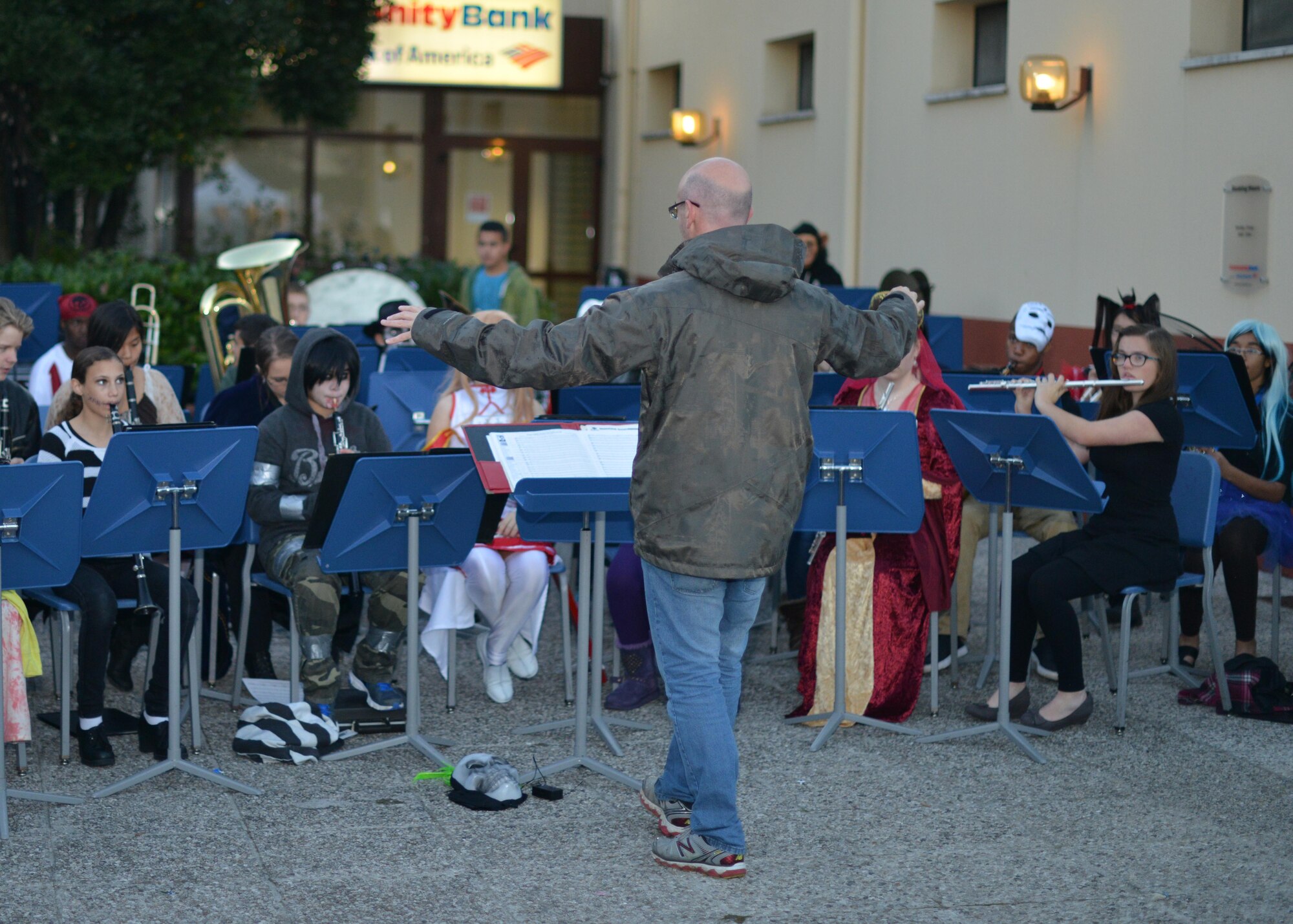 Sean Boyle, Aviano Middle/High School band teacher, directs the MHS Advanced Band during a performance at Fall Fest, November 1, 2014, at Aviano Air Base, Italy. Fall Fest offered Department of Defense cardholders and their families a chance to celebrate Halloween in a fun and safe environment. While at Fall Fest, families enjoyed trick-or-treat-booths, food stands, a costume parade and carnival games.  (U.S. Air Force photo/Tech. Sgt. Eric Donner)